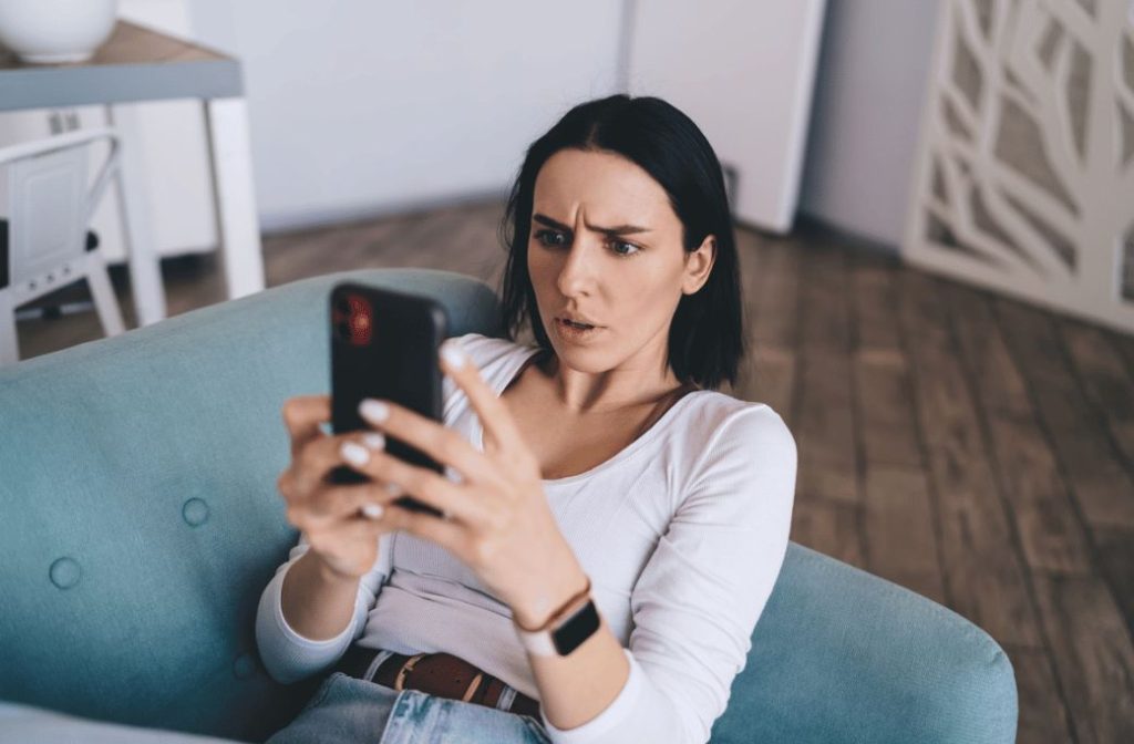 Woman trying to troubleshoot her phone